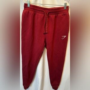 Gymshark Size Medium Crest Jogger Red Burgundy Stretch Drawstring 27” Inseam